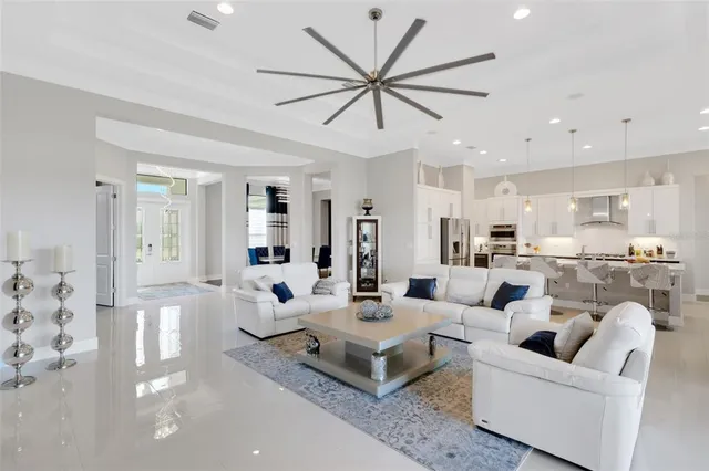 a spacious bedroom with a bed and a flat screen tv