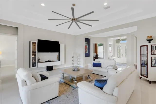 a bedroom with a bed couch and window