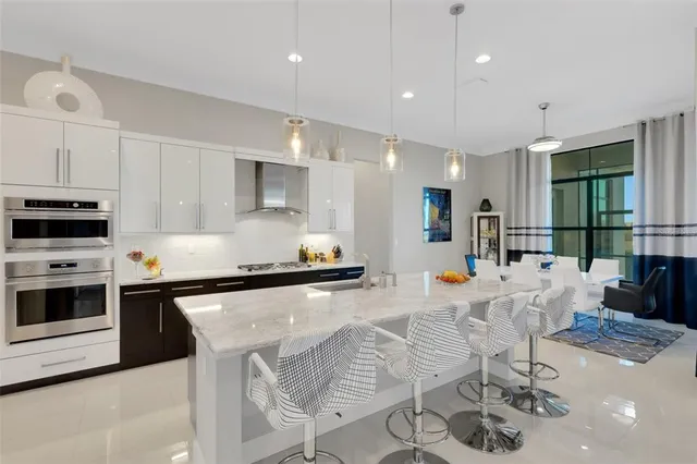 a spacious bedroom with a bed and a flat screen tv