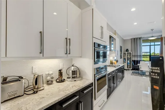 a bathroom with a tub sink and a window