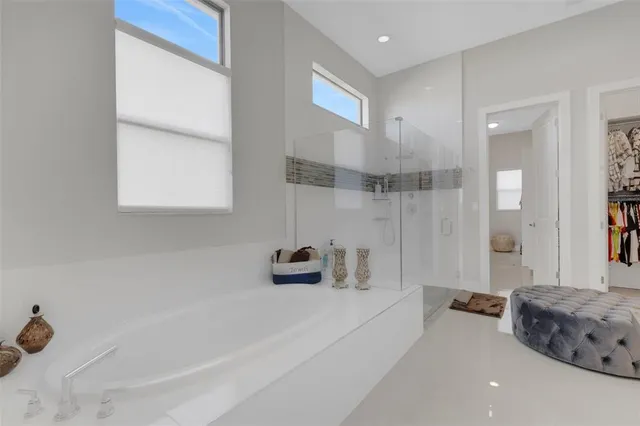 a bathroom with a granite countertop sink and a toilet