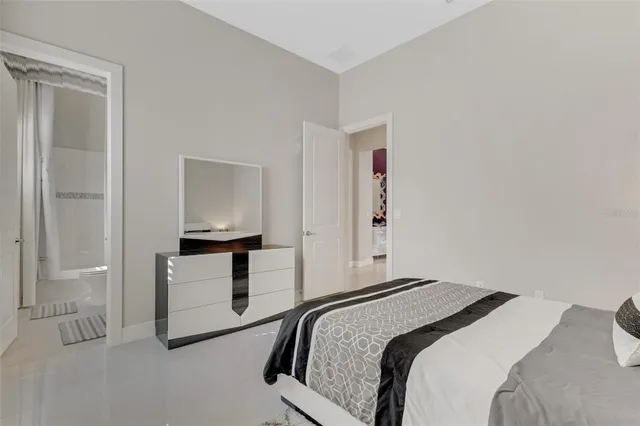 an aerial view of residential houses with outdoor space and lake view