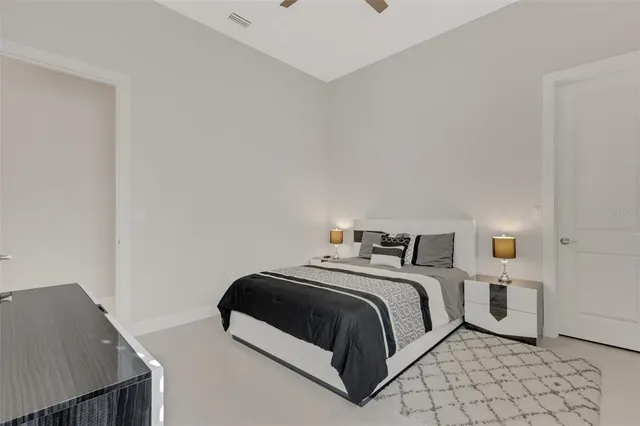 an aerial view of residential houses with outdoor space and ocean view