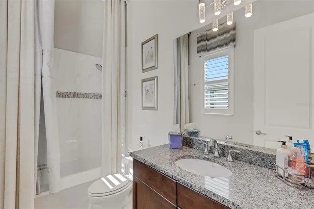 a view of a lake with boats and trees in the background