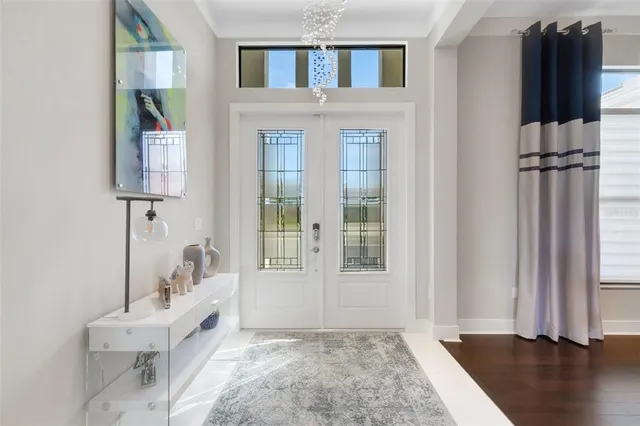 a kitchen with stainless steel appliances kitchen island granite countertop a stove top oven a sink a dining table and chairs