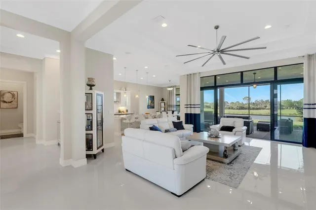 a kitchen with granite countertop white cabinets and a sink