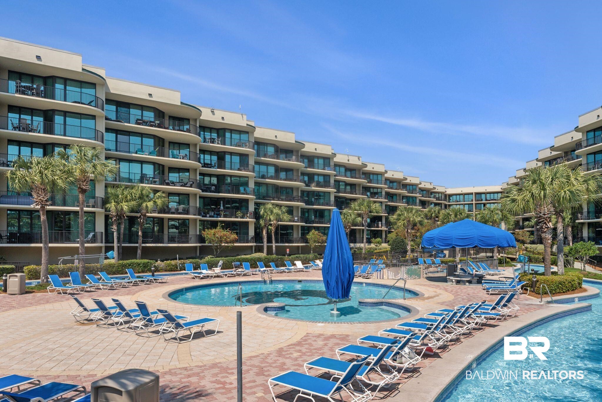 27580 Canal Road, Unit 1233 Orange Beach, AL 36561 - Photo 63 of 79 Community pool featuring a patio area