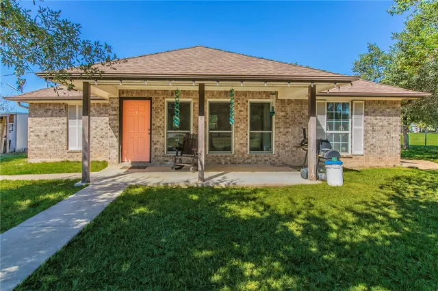 front view of a house with a yard