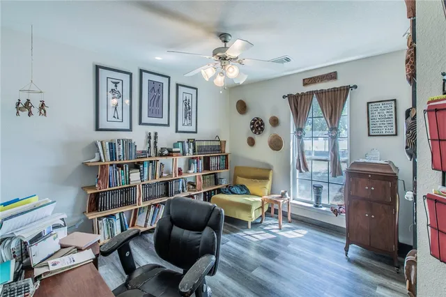 a view of a livingroom with workspace and a couch