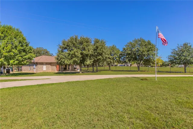 a view of a playground with basketball court