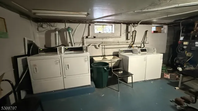 a view of a storage & utility room with washer and dryer