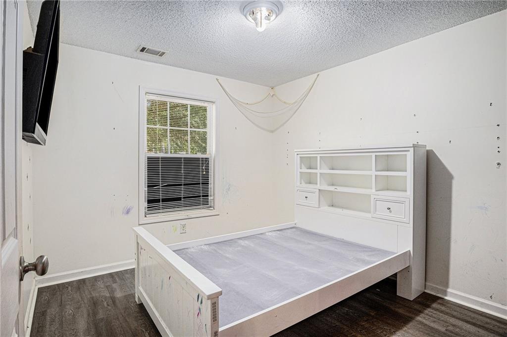 1224 Dylan Way Bethlehem, GA 30620 - Photo 15 of 33 a room with a bed and a window