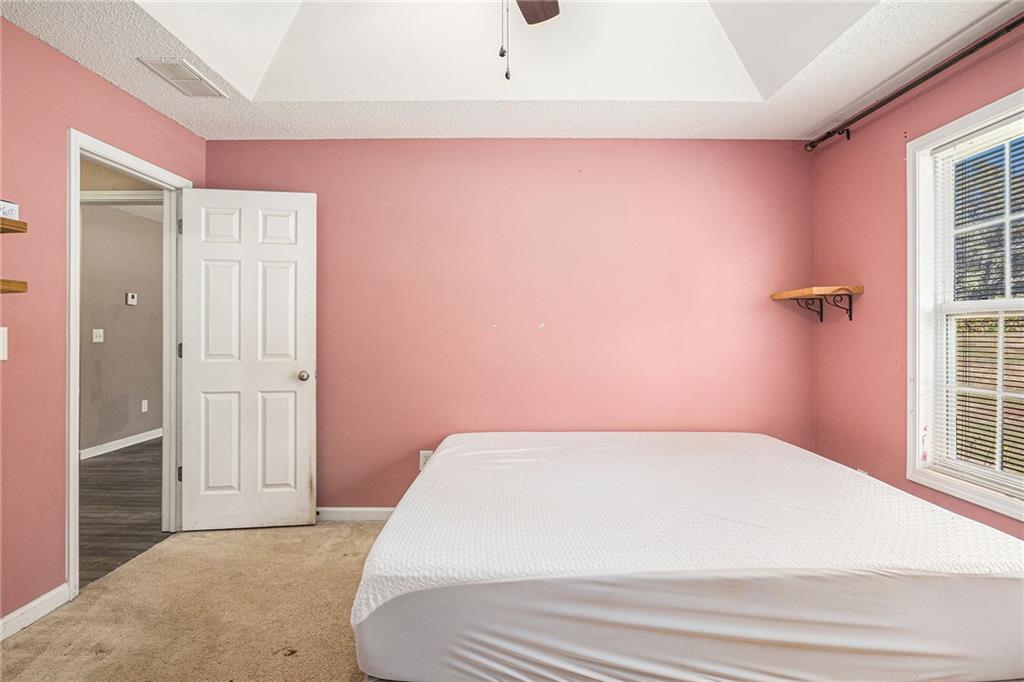 1224 Dylan Way Bethlehem, GA 30620 - Photo 24 of 33 a bedroom with a bed and a window