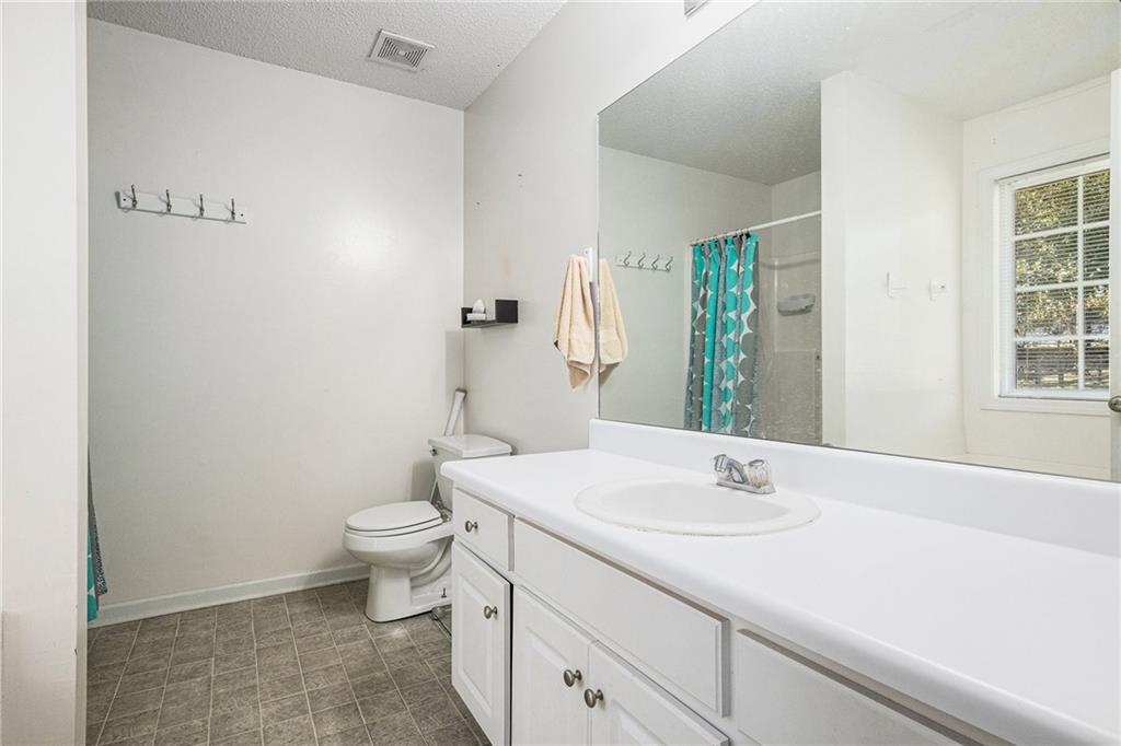 1224 Dylan Way Bethlehem, GA 30620 - Photo 25 of 33 a bathroom with a sink toilet and shower
