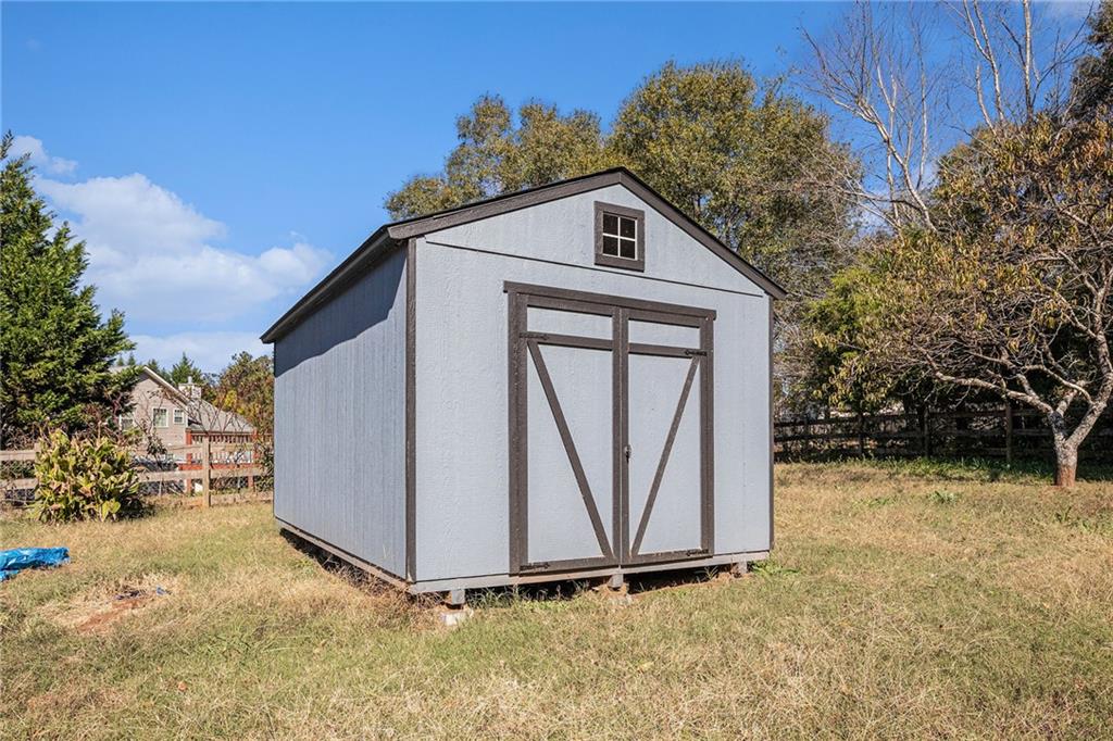 1224 Dylan Way Bethlehem, GA 30620 - Photo 28 of 33 a house with trees in front of it