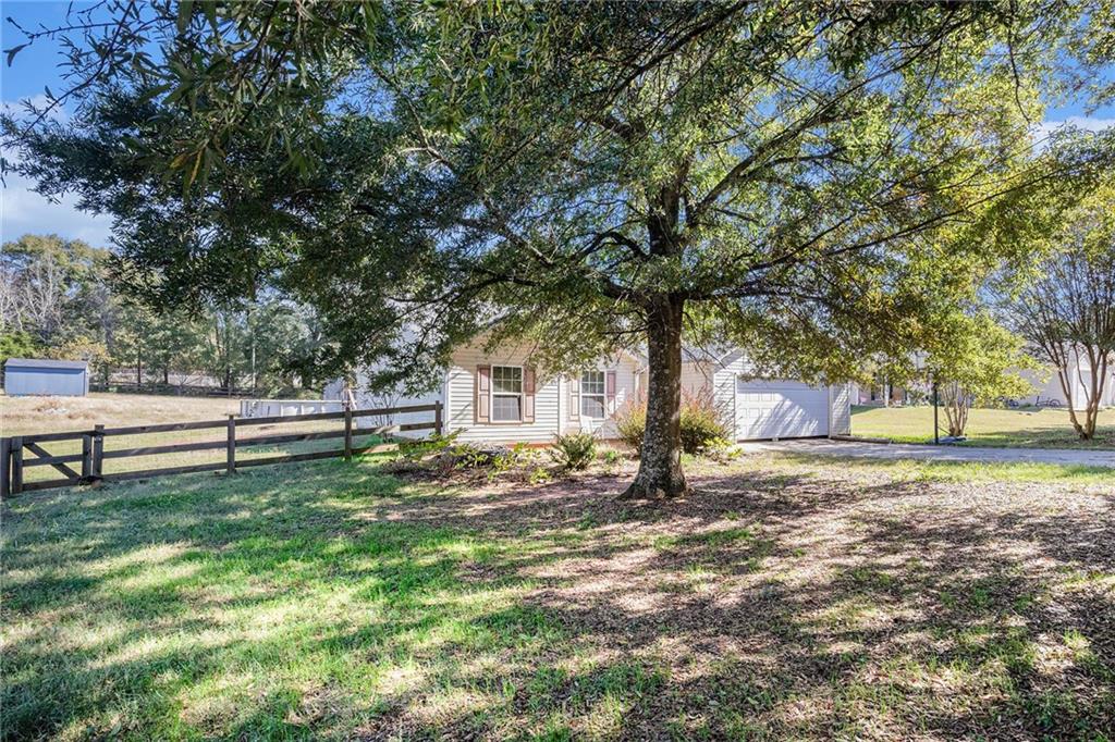 1224 Dylan Way Bethlehem, GA 30620 - Photo 3 of 33 a view of a house with a yard