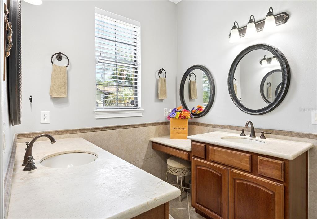 11325 Preston Cove Road Clermont, FL 34711 - Photo 23 of 58 a bathroom with a sink and a mirror