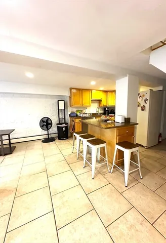 a view of kitchen with furniture and stove