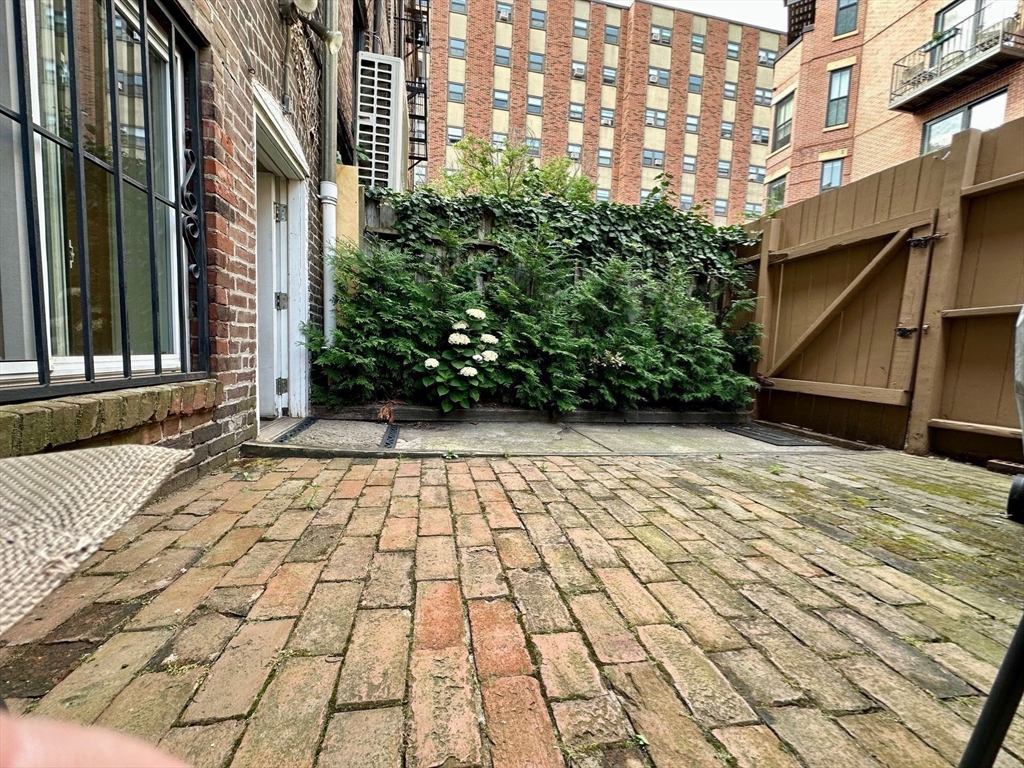 12 Follen Street, Unit ONEA Boston, MA 02116 - Photo 19 of 23 a view of a pathway both side of building