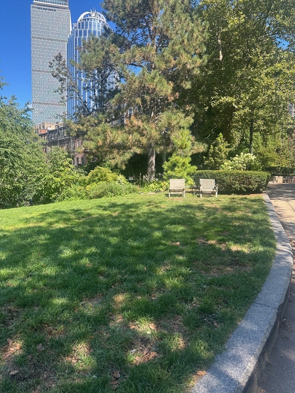 12 Follen Street, Unit ONEA Boston, MA 02116 - Photo 21 of 23 a backyard of a building with trees all around