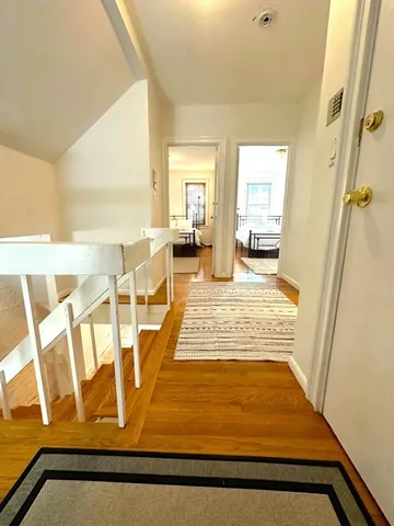 a bedroom with bed and a window