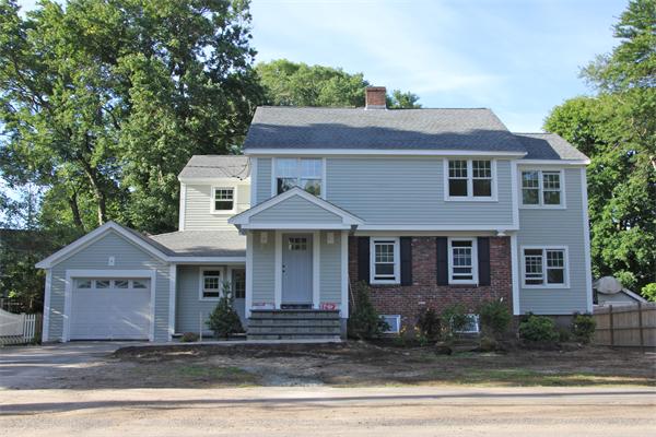 298 Brookline Street Needham, MA 02492 - Photo 3 of 4 a front view of a house with a yard