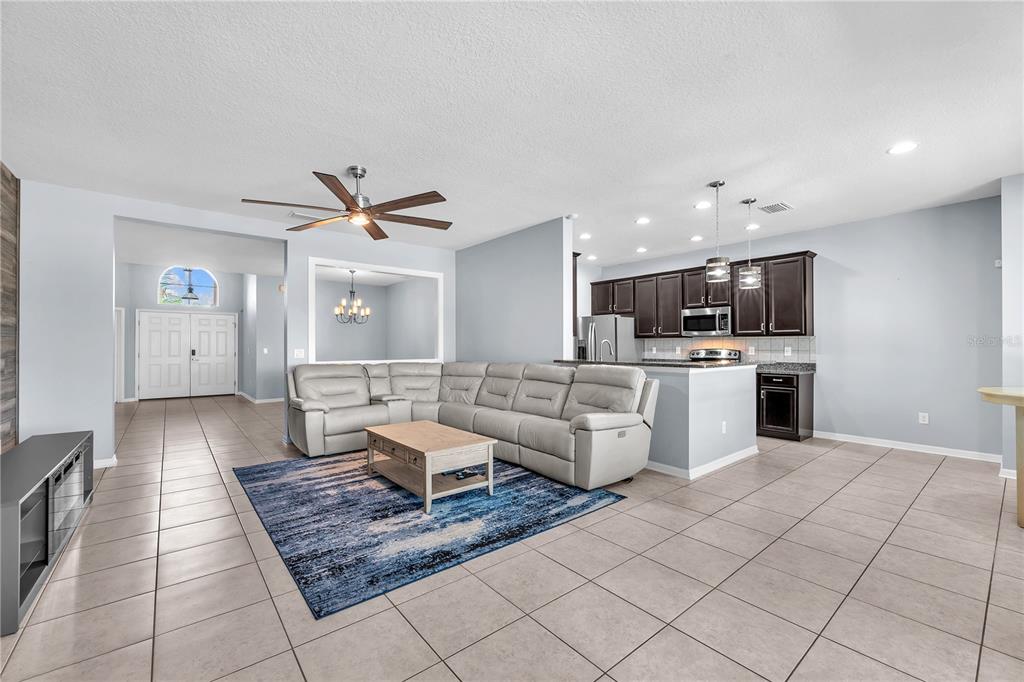11236 77th Street East Parrish, FL 34219 - Photo 14 of 53 a living room with furniture and kitchen view