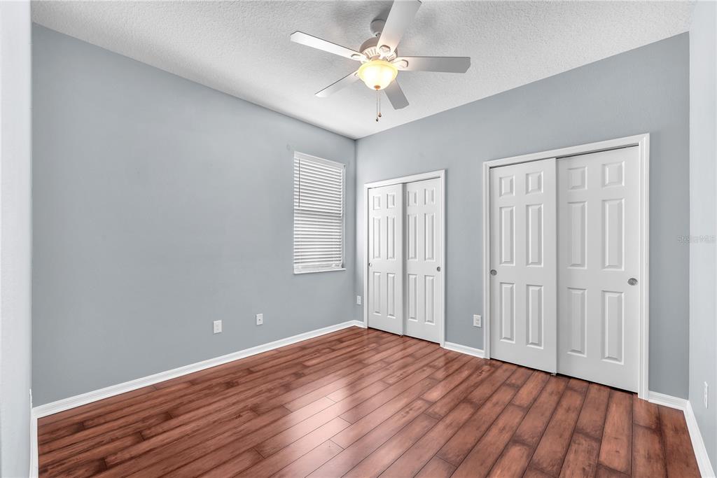 11236 77th Street East Parrish, FL 34219 - Photo 22 of 53 wooden floor in an empty room with a window