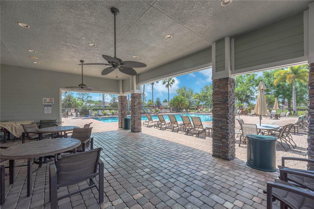 11236 77th Street East Parrish, FL 34219 - Photo 45 of 53 a living room with furniture floor to ceiling window and outdoor view