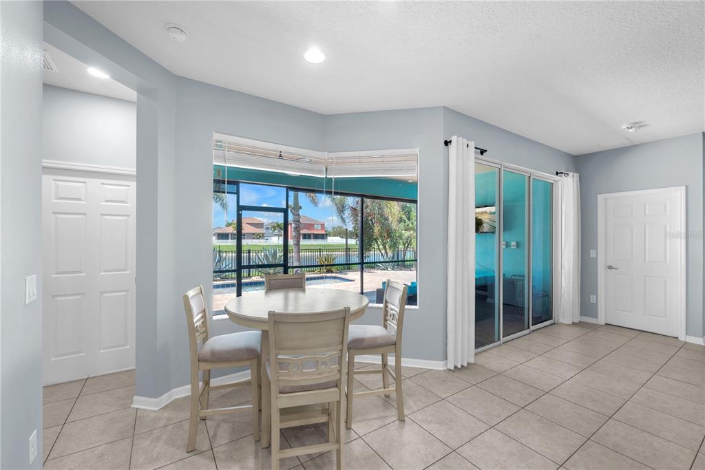 11236 77th Street East Parrish, FL 34219 - Photo 7 of 53 a dining room with furniture and window