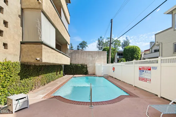 a view of a swimming pool with a slide