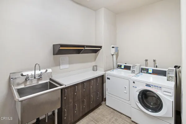 a view of a big room with windows and closet