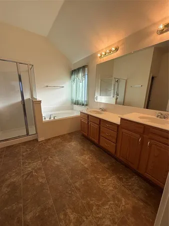 a bathroom with a sink a vanity and mirror
