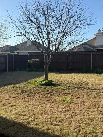 a view of a backyard of the house