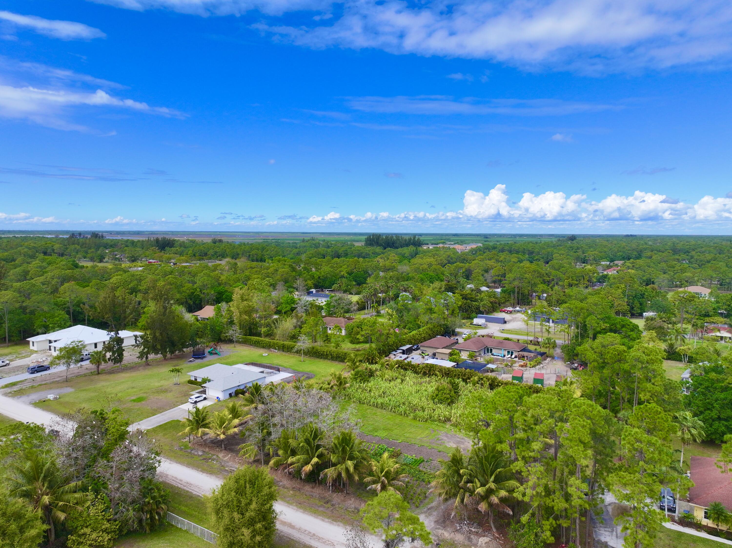 17853 60th Loxahatchee, FL 33470 - Photo 34 of 37 a view of a golf course with a building in the background