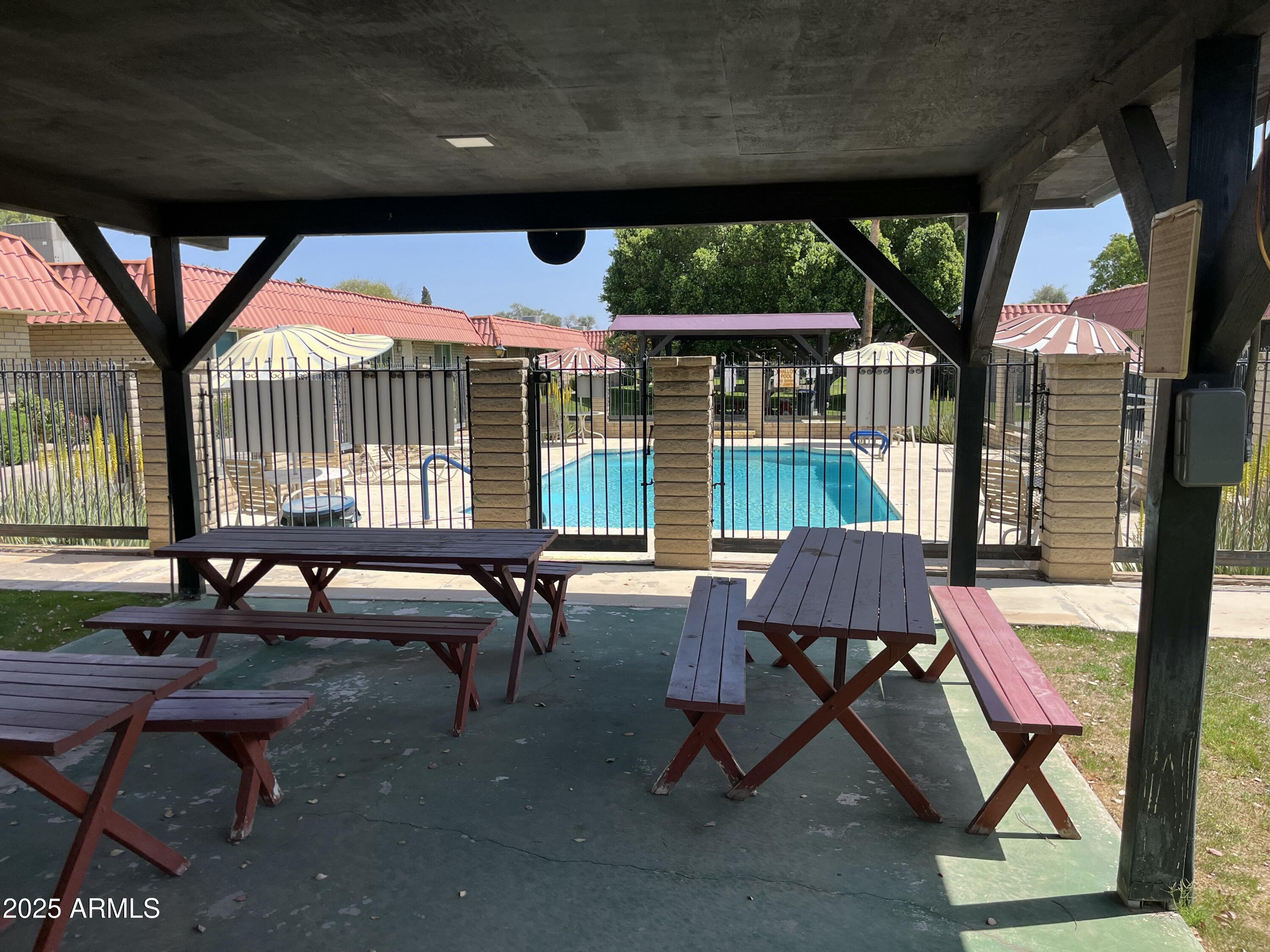 141 North Date, Unit 7 Mesa, AZ 85201 - Photo 13 of 15 a house view with a sitting space and garden