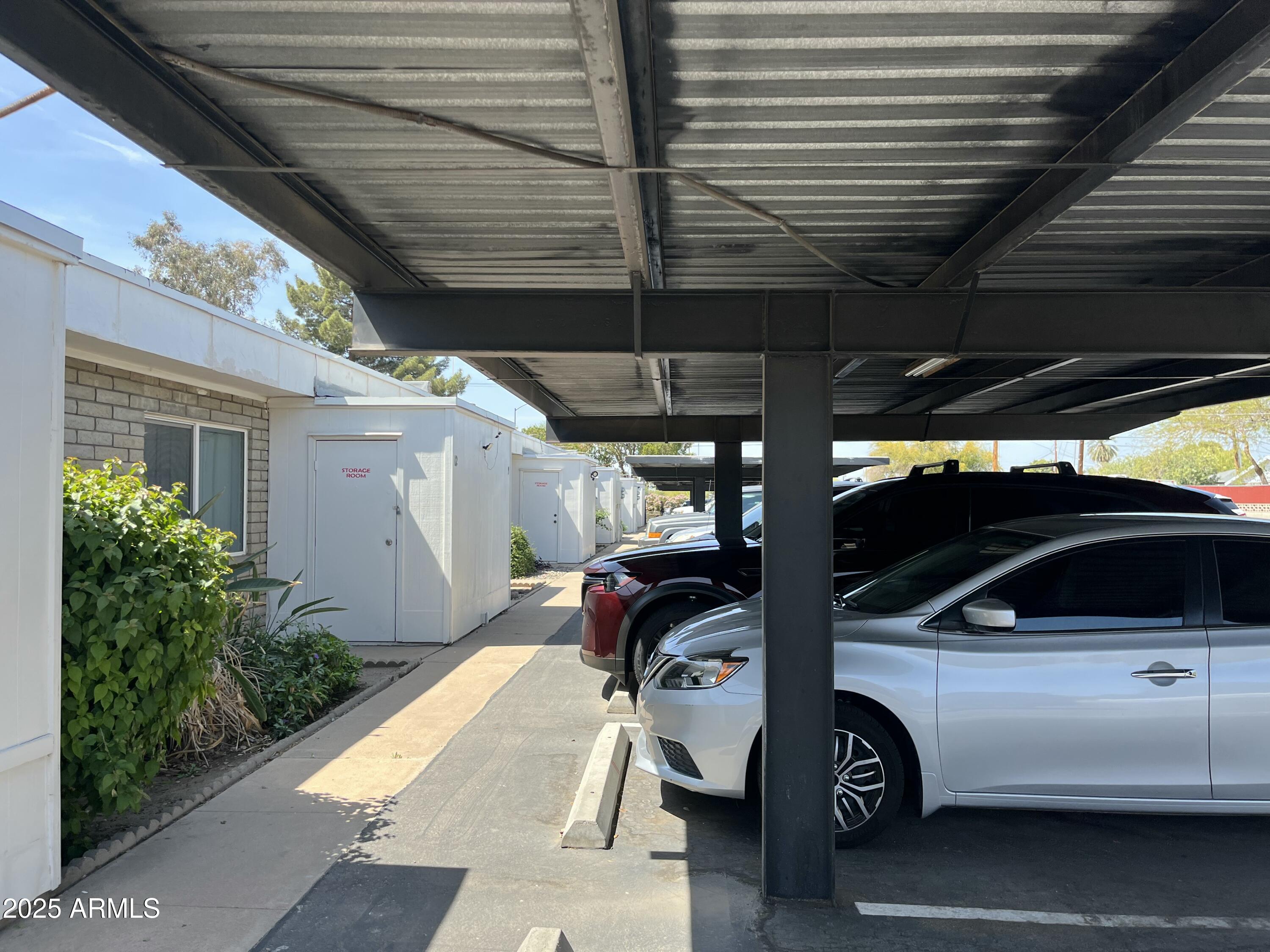 141 North Date, Unit 7 Mesa, AZ 85201 - Photo 14 of 15 a view of garage with cars