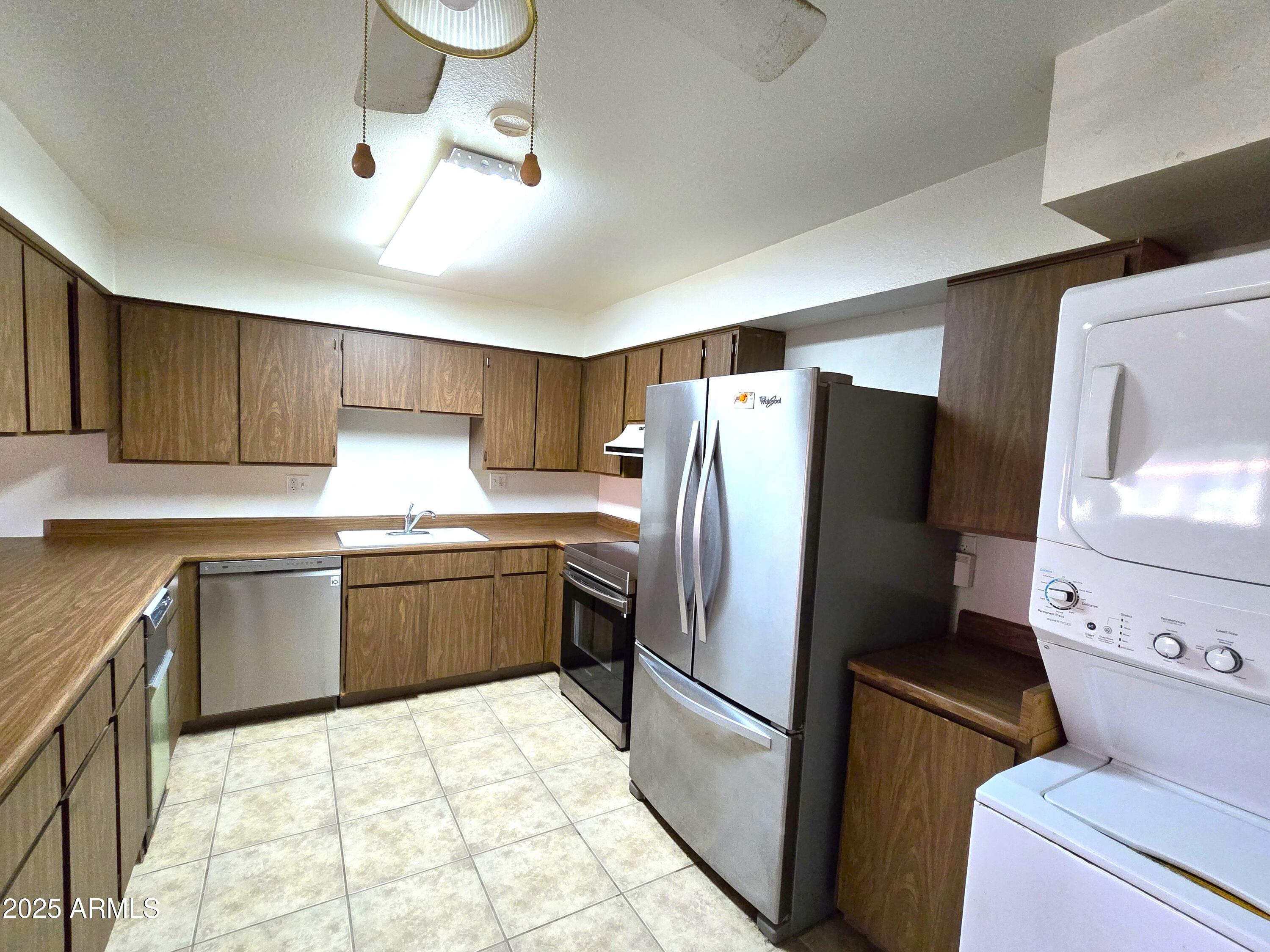 141 North Date, Unit 7 Mesa, AZ 85201 - Photo 5 of 15 a kitchen with a refrigerator sink and stove