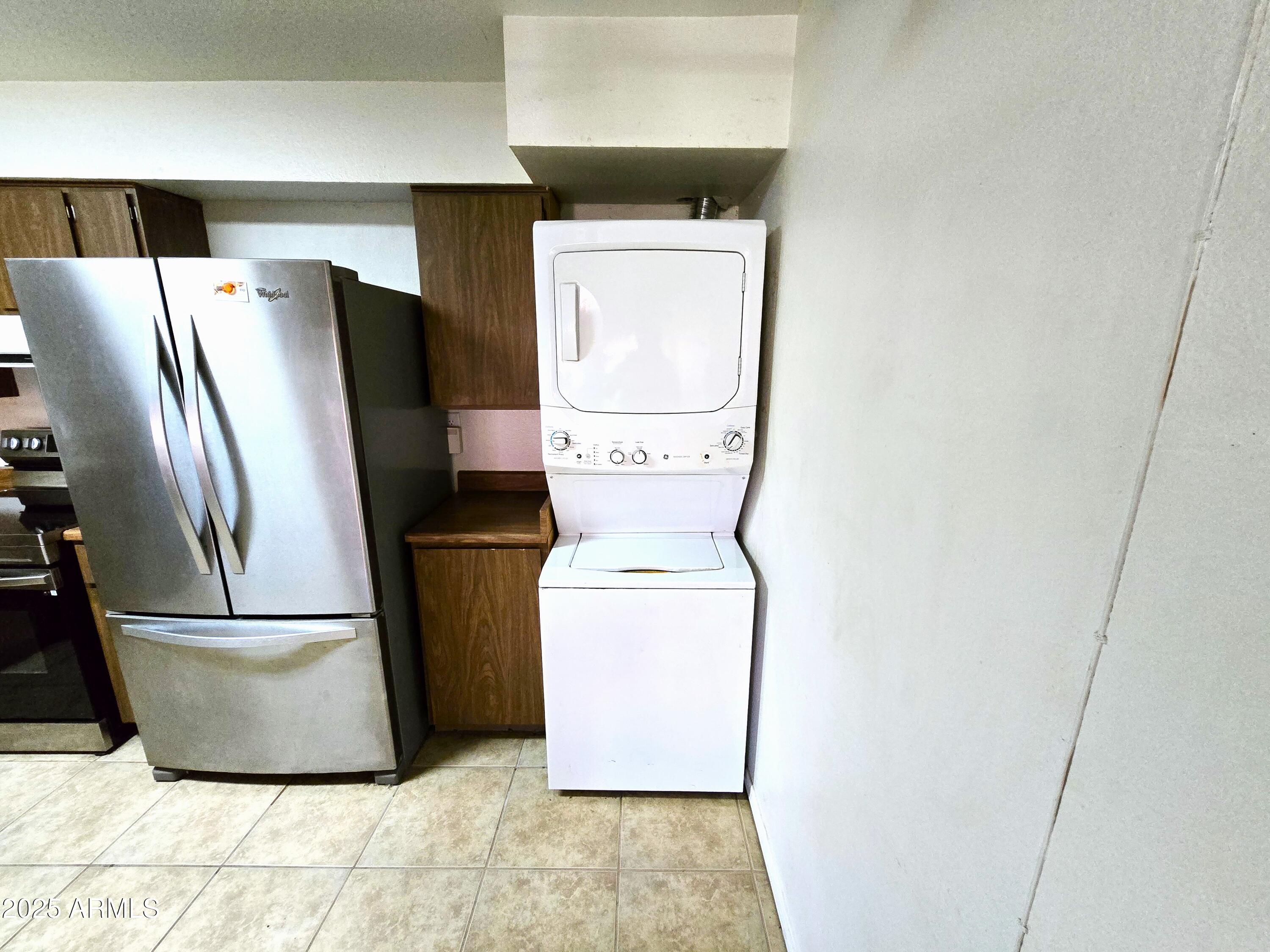 141 North Date, Unit 7 Mesa, AZ 85201 - Photo 6 of 15 a utility room with wooden floor washer and dryer