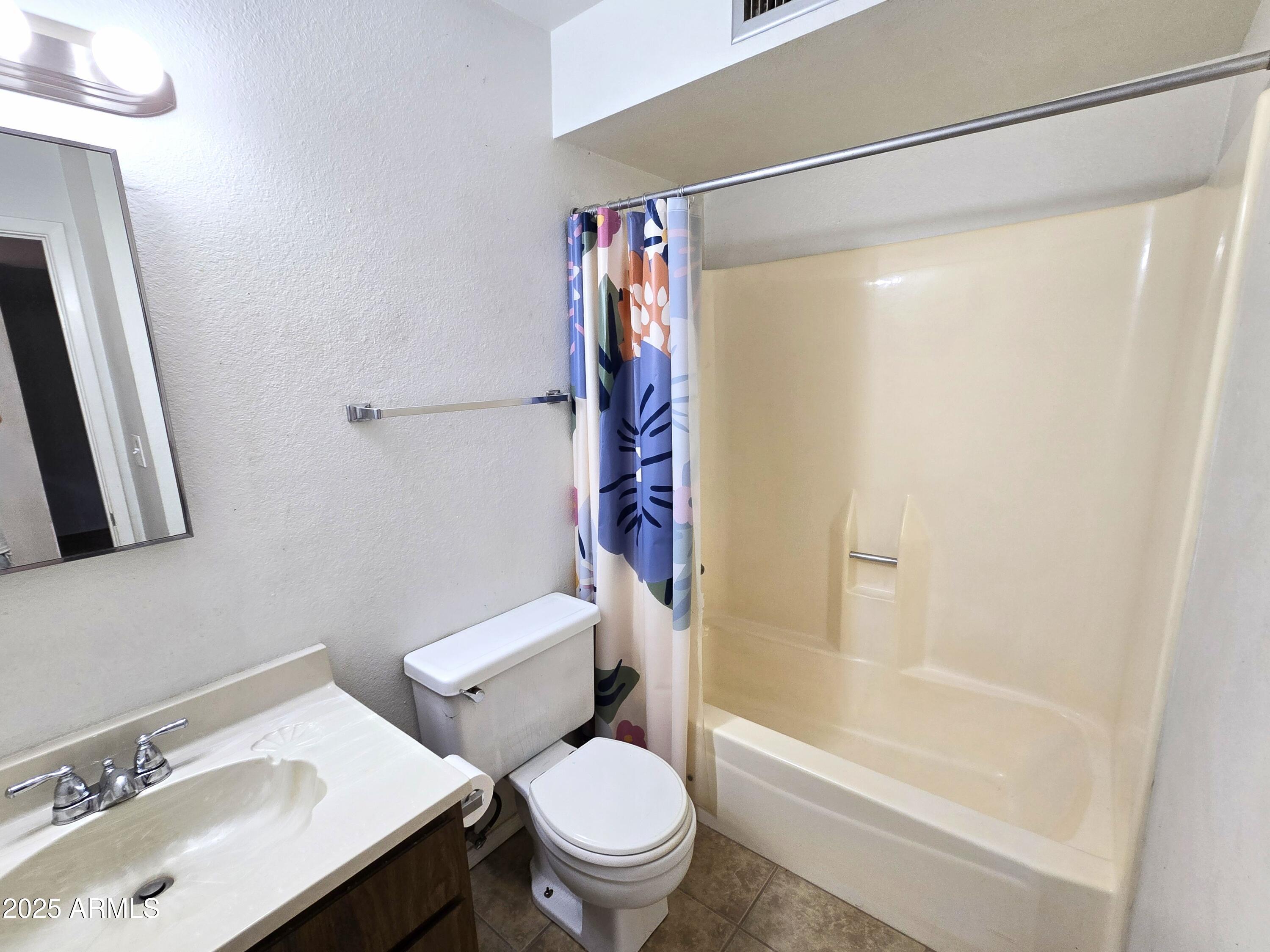 141 North Date, Unit 7 Mesa, AZ 85201 - Photo 10 of 15 a bathroom with a sink toilet and shower