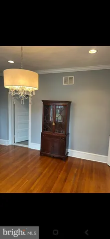a view of an empty room with a fireplace