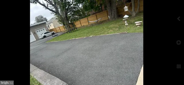 a view of a backyard of the house