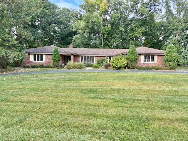 24360 South Timberline Trail Crete, IL 60417 - Photo 1 of 25 a front view of a house with a garden