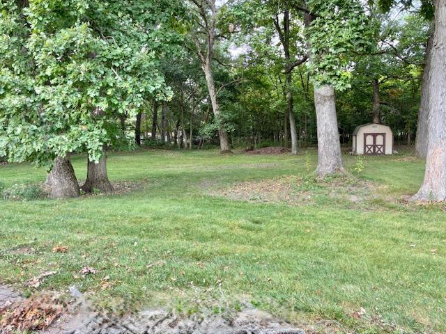 24360 South Timberline Trail Crete, IL 60417 - Photo 25 of 25 a backyard of a house with trees and plants