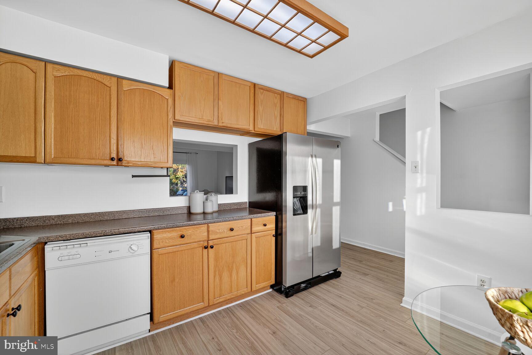 779 Match Point Drive Arnold, MD 21012 - Photo 12 of 28 a kitchen with sink cabinets and wooden floor
