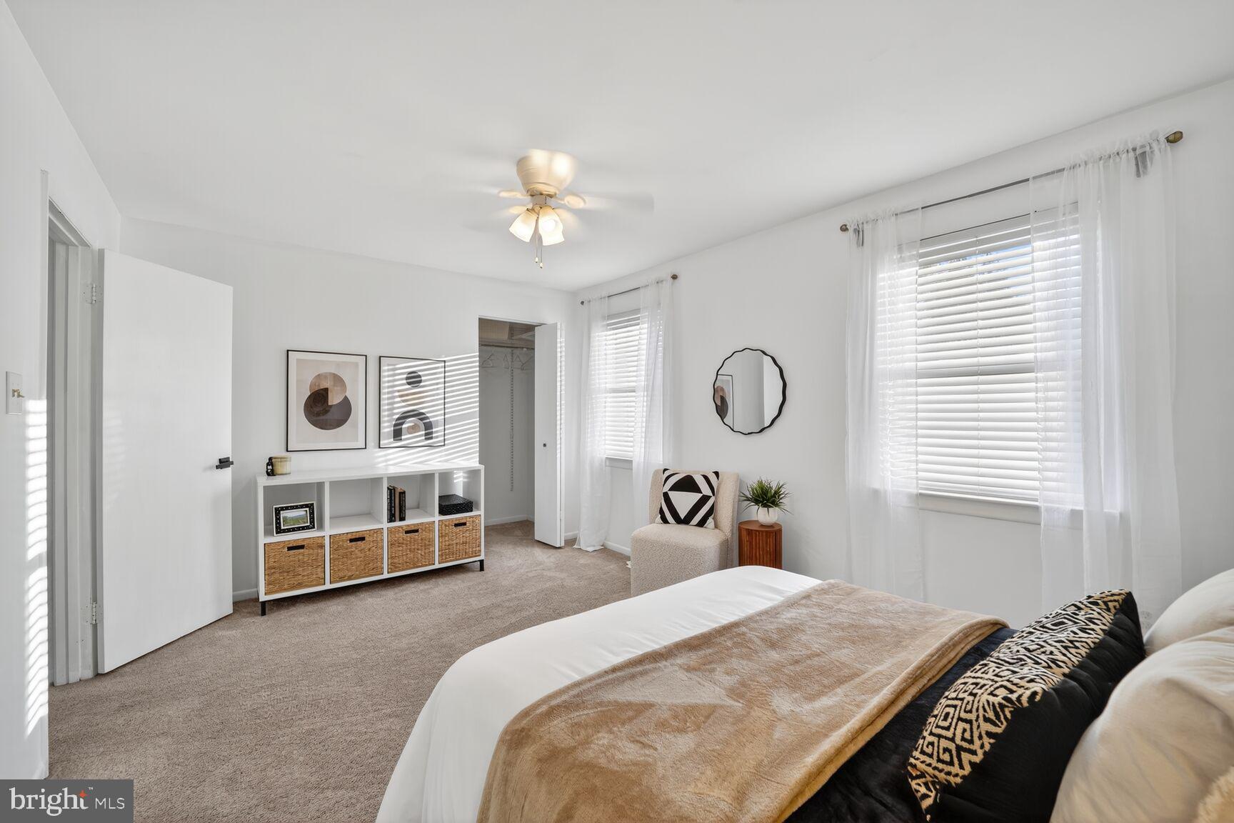 779 Match Point Drive Arnold, MD 21012 - Photo 15 of 28 a bedroom with a bed and dresser with wooden floor