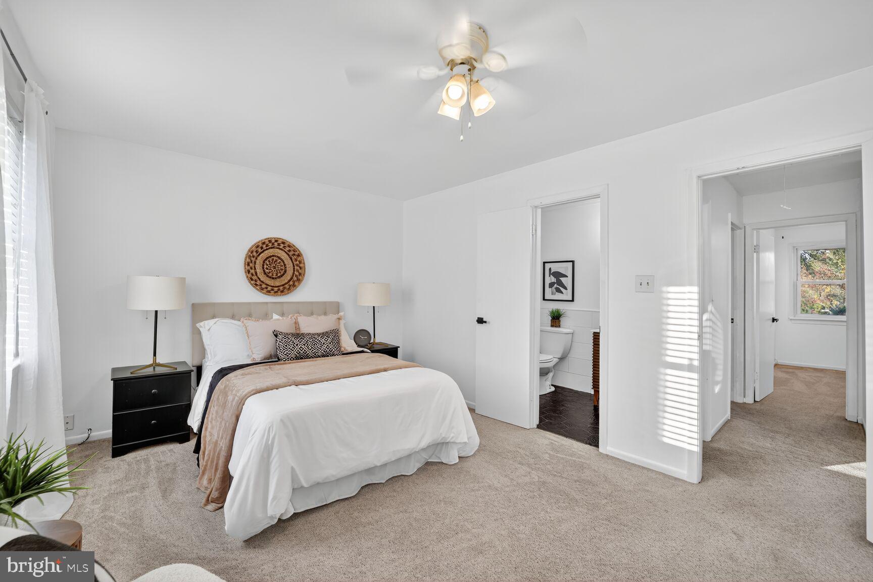 779 Match Point Drive Arnold, MD 21012 - Photo 16 of 28 a bedroom with a bed and a chandelier