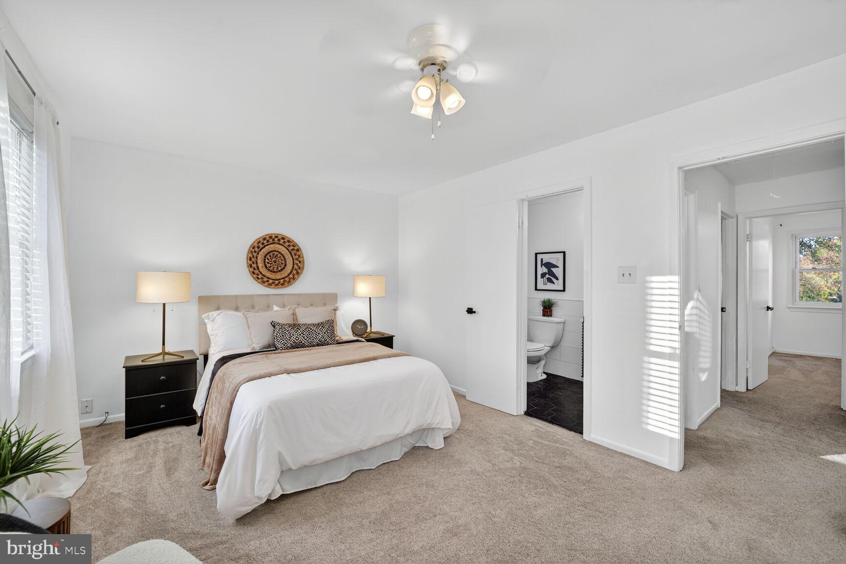 779 Match Point Drive Arnold, MD 21012 - Photo 17 of 28 a bedroom with a bed and a chandelier