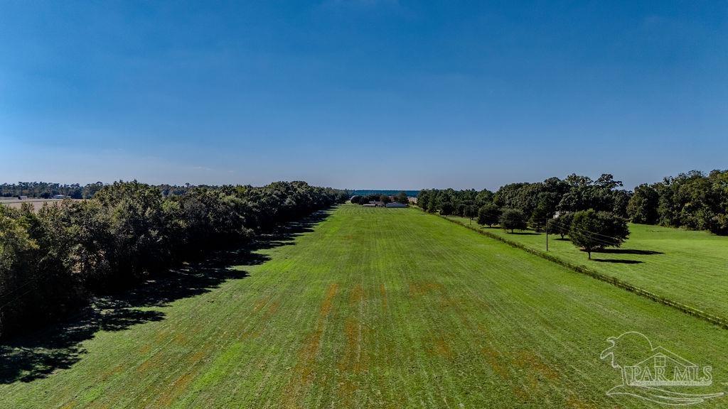 3 A Tidwell Road Pace, FL 32571 - Photo 6 of 13 a view of a field with an ocean