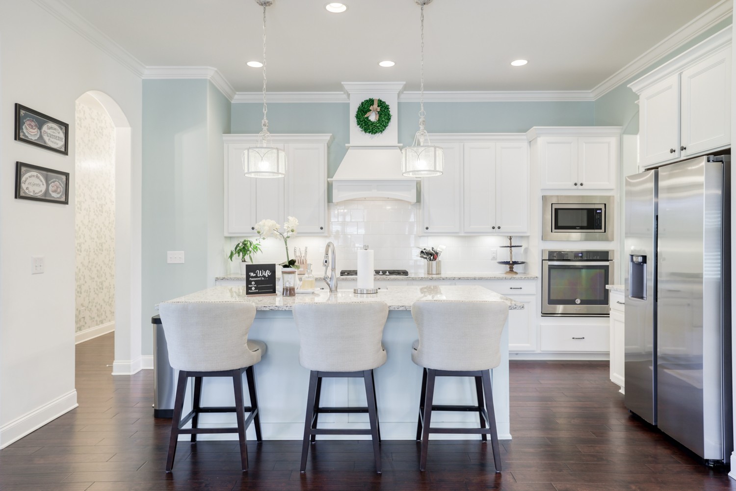 1146 Batbriar Road Murfreesboro, TN 37128 - Photo 16 of 56 a kitchen with stainless steel appliances kitchen island granite countertop a dining table chairs refrigerator and microwave